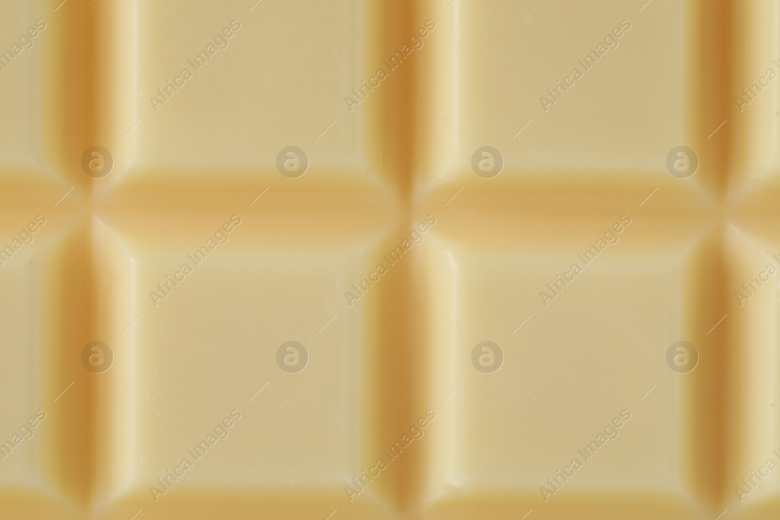 Photo of Delicious white chocolate as background, closeup view