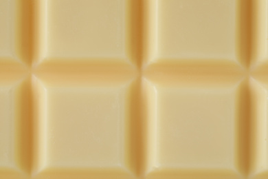 Delicious white chocolate as background, closeup view