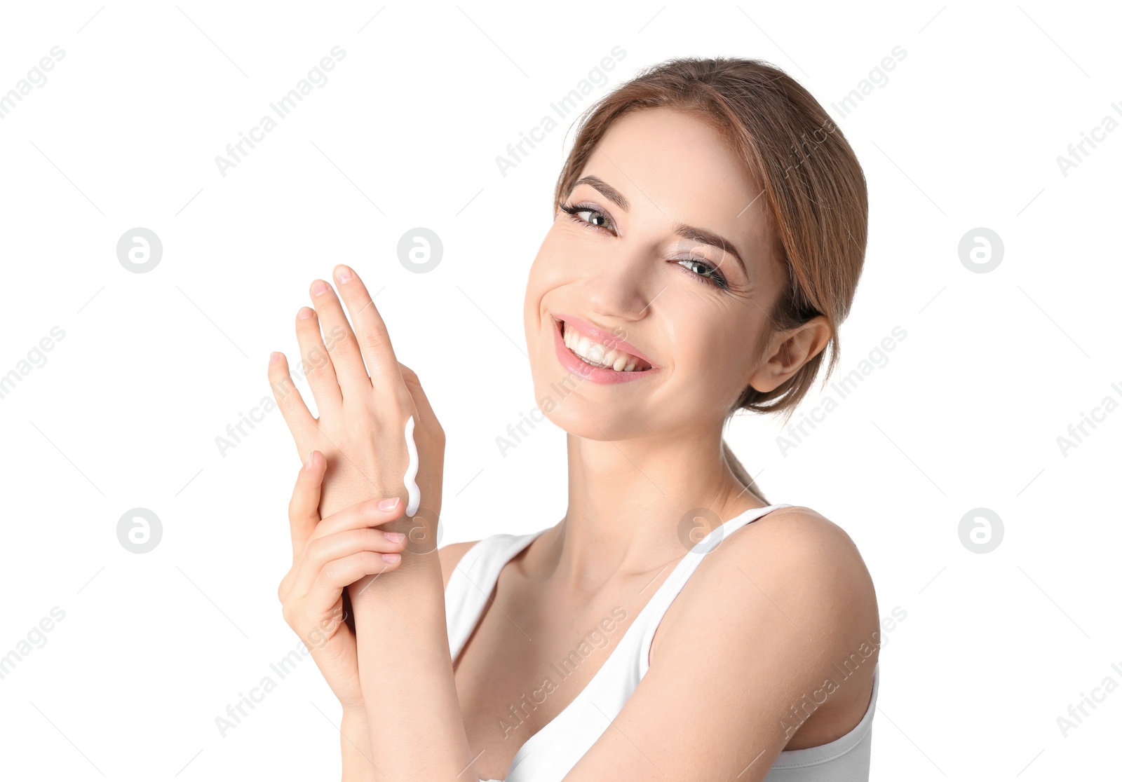 Photo of Young woman applying hand cream on white background