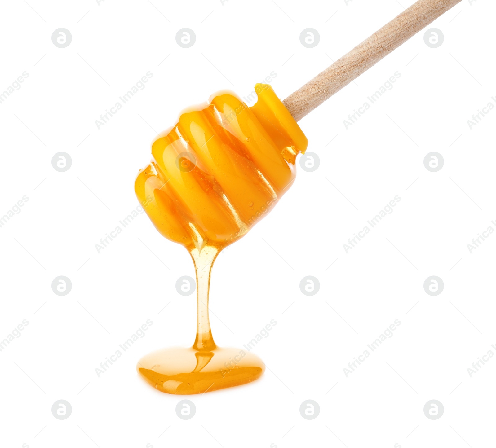 Photo of Honey pouring from dipper isolated on white