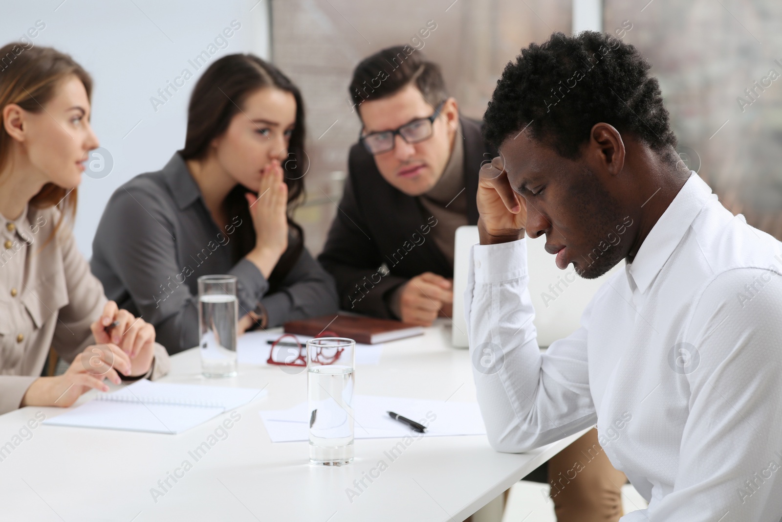 Photo of African American man suffering from racial discrimination at work