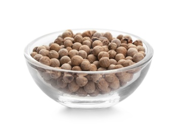 Glass bowl with pepper grains on white background