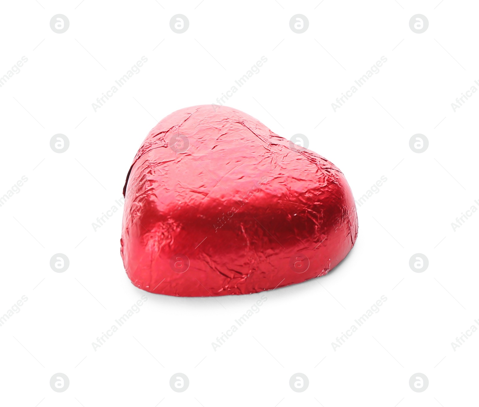 Photo of Heart shaped chocolate candy in red foil isolated on white