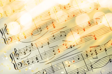 Image of Sheet with music notes as background, closeup. Bokeh effect