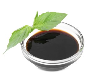Photo of Organic balsamic vinegar and basil isolated on white