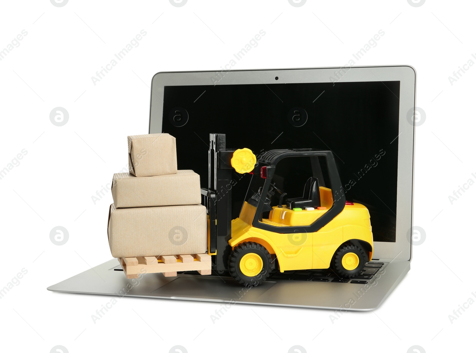 Photo of Laptop, toy forklift with wooden pallet and boxes on white background