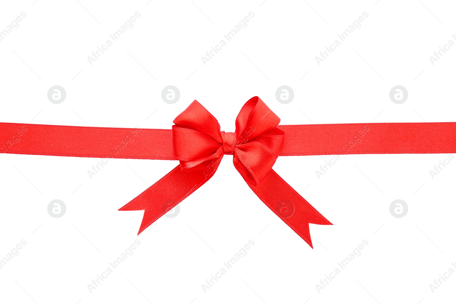 Photo of Red ribbon with bow on white background, top view