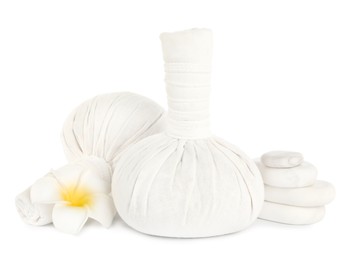 Herbal massage bags, flower and spa stones on white background