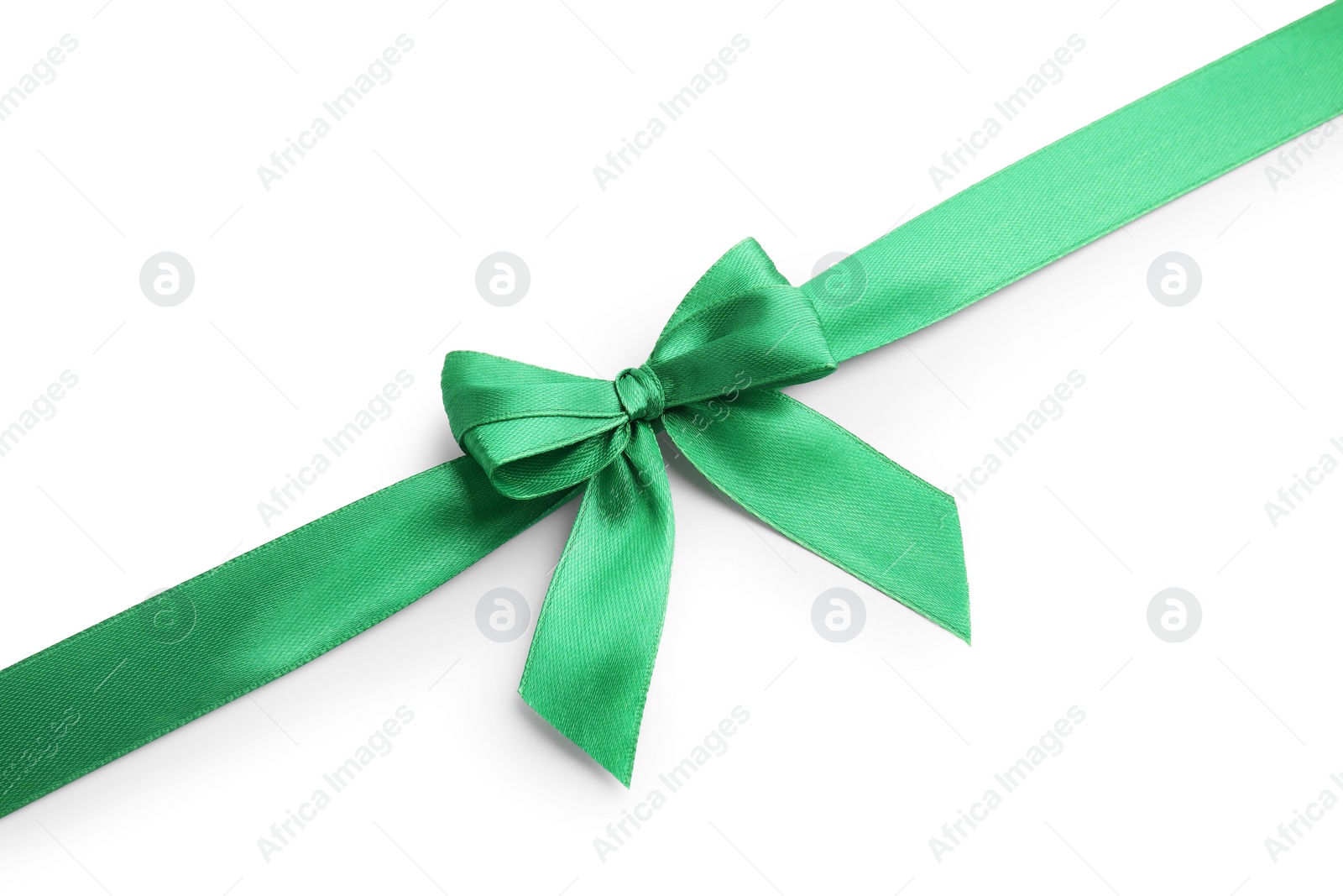 Photo of Green satin ribbon with bow isolated on white, top view