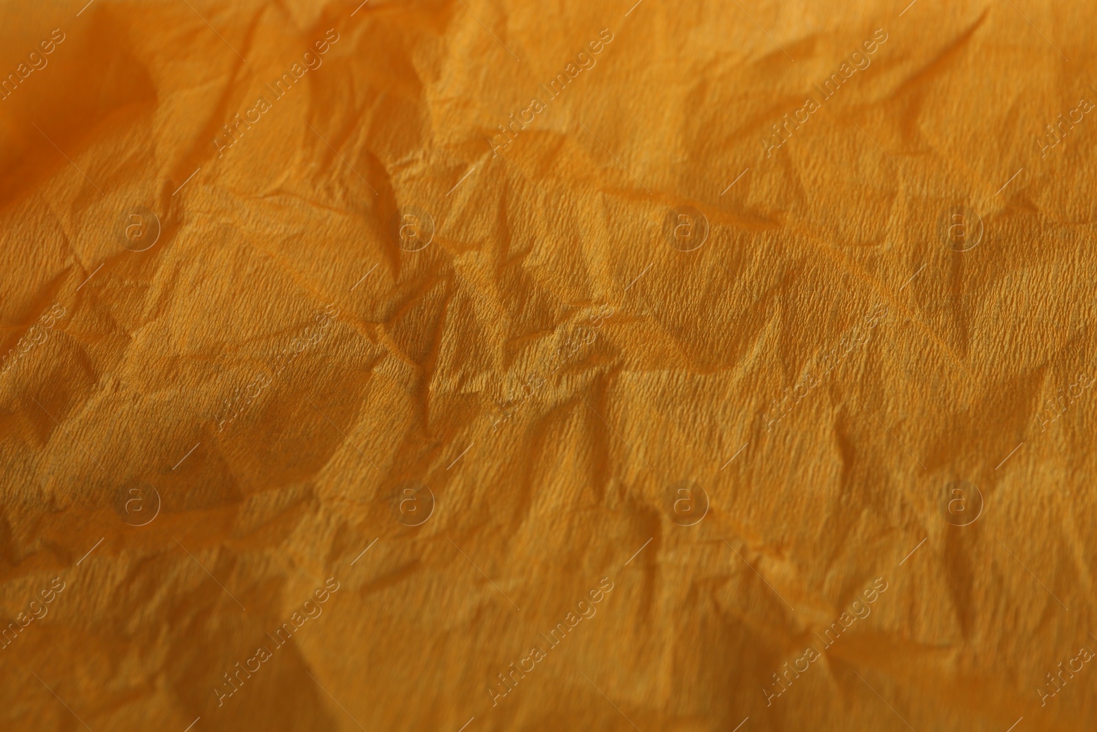 Photo of Orange textured material as background, closeup view