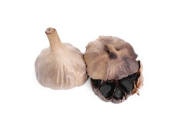 Photo of Organic fermented black garlic isolated on white, top view