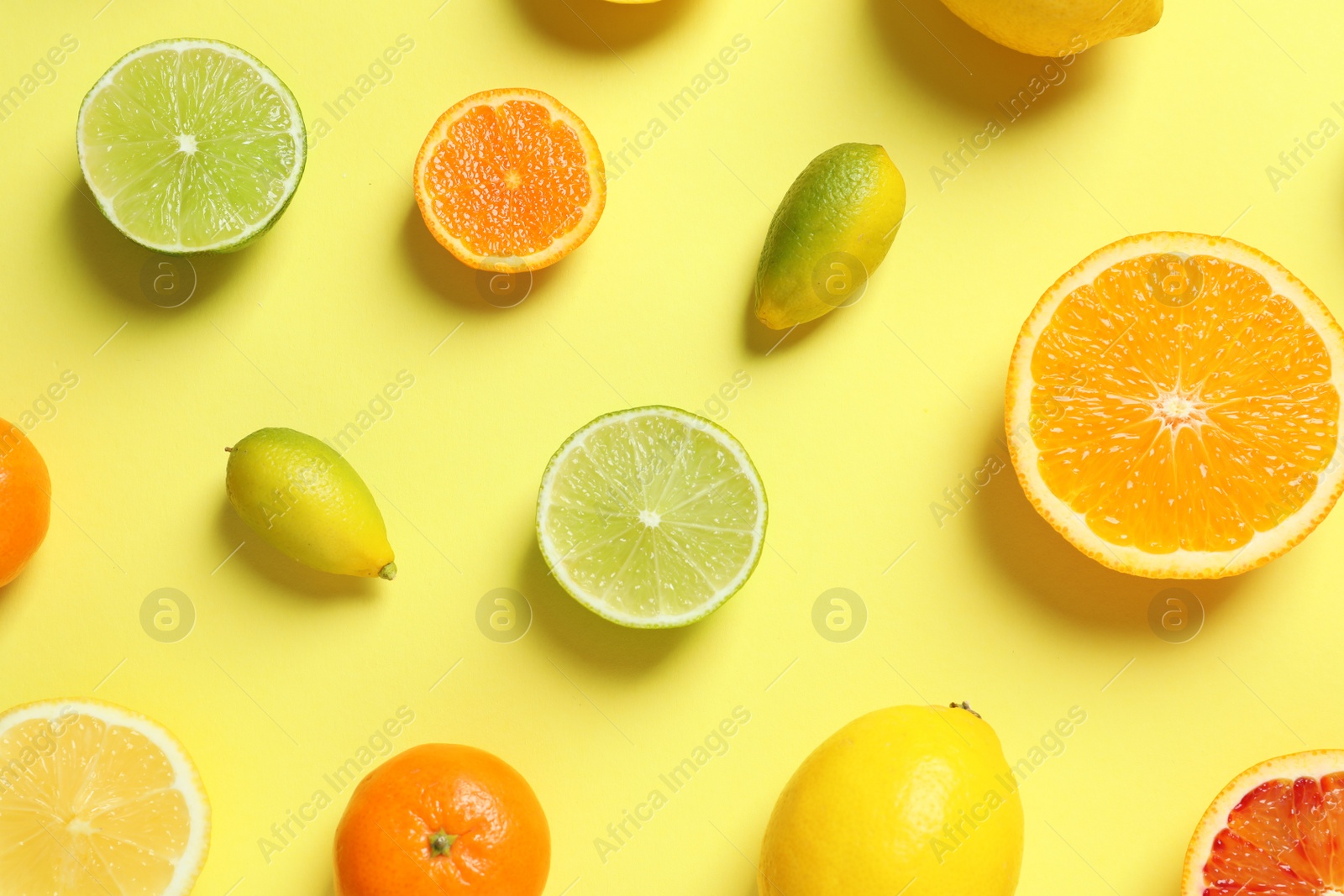 Photo of Different citrus fruits on color background, flat lay