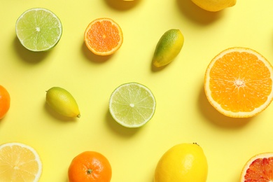 Photo of Different citrus fruits on color background, flat lay