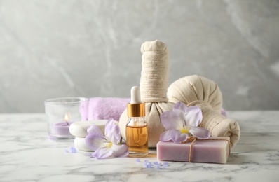 Photo of Spa composition with skin care products on white marble table