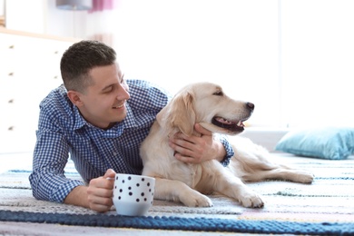 Photo of Portrait of owner with his friendly dog at home