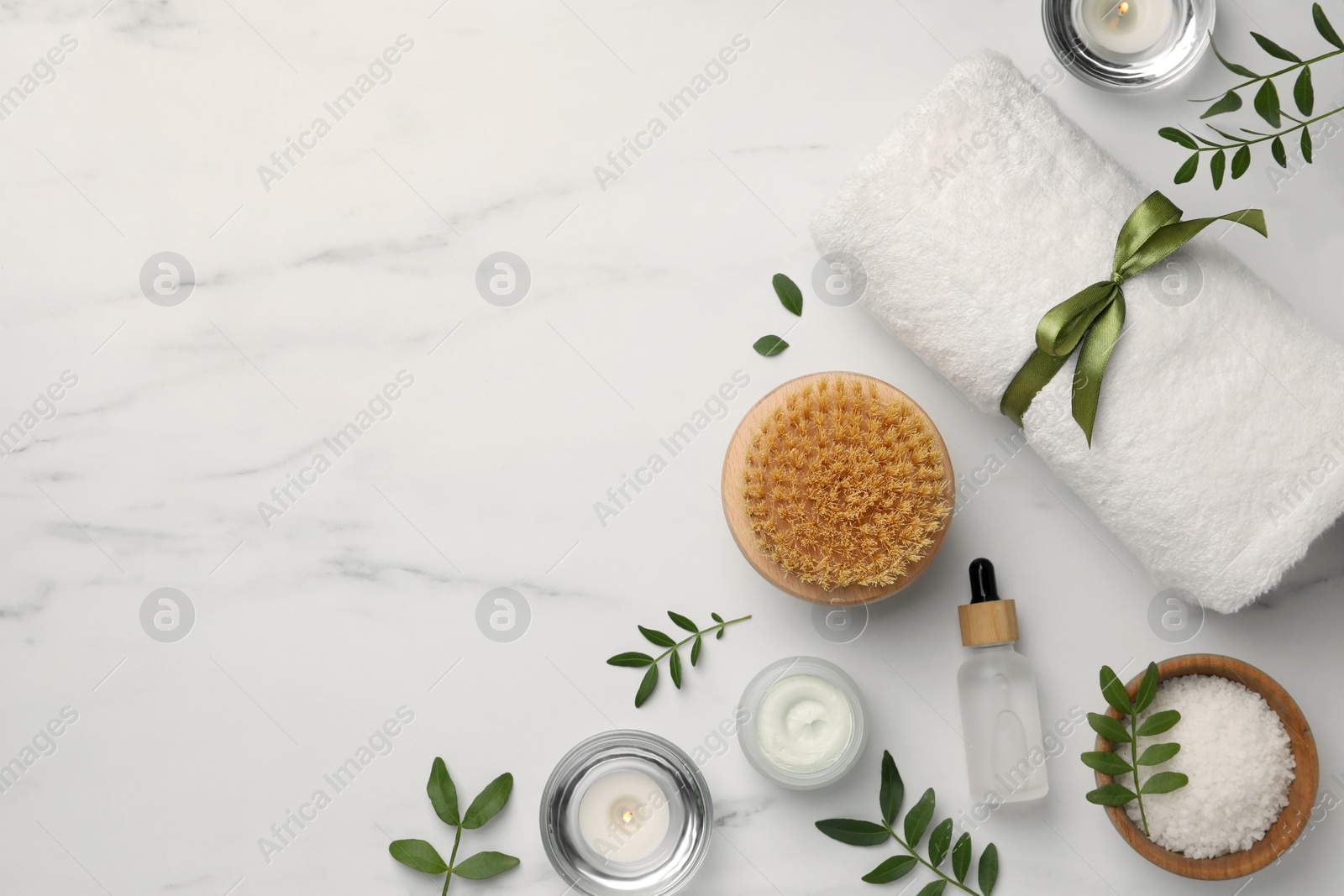 Photo of Flat lay composition with different spa products on white marble table. Space for text