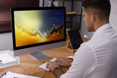 Photo of Businessman working with computer in office. Forex trading