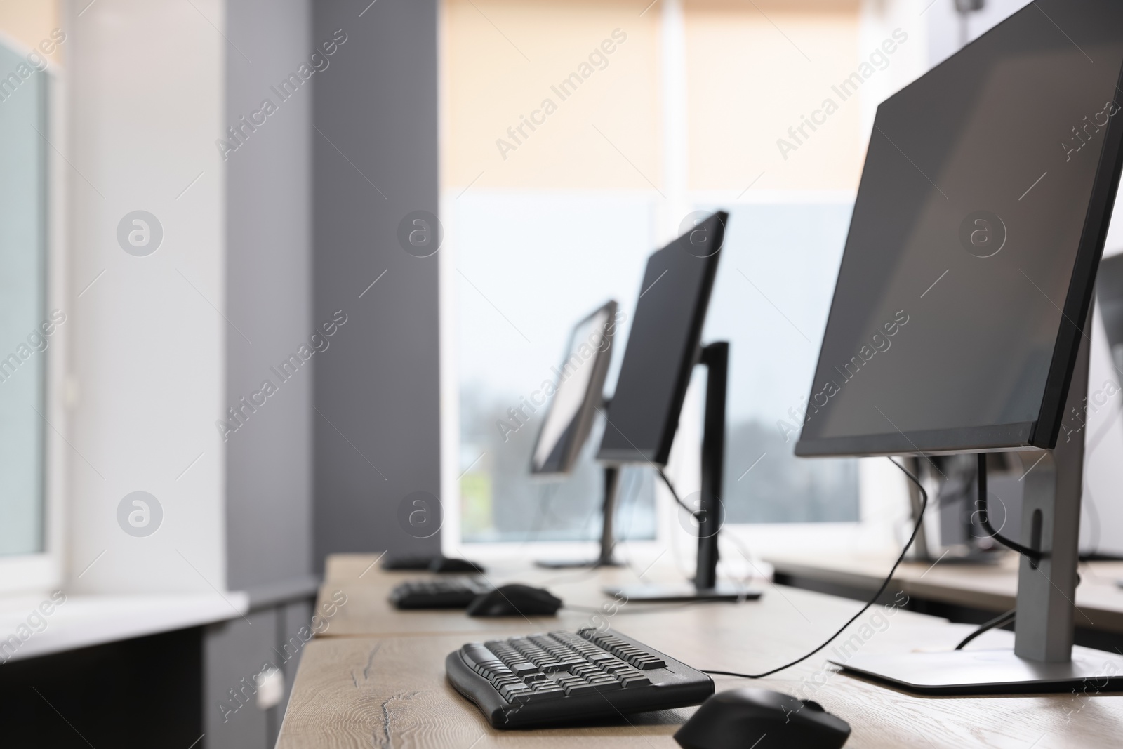 Photo of Many modern computers in open space office