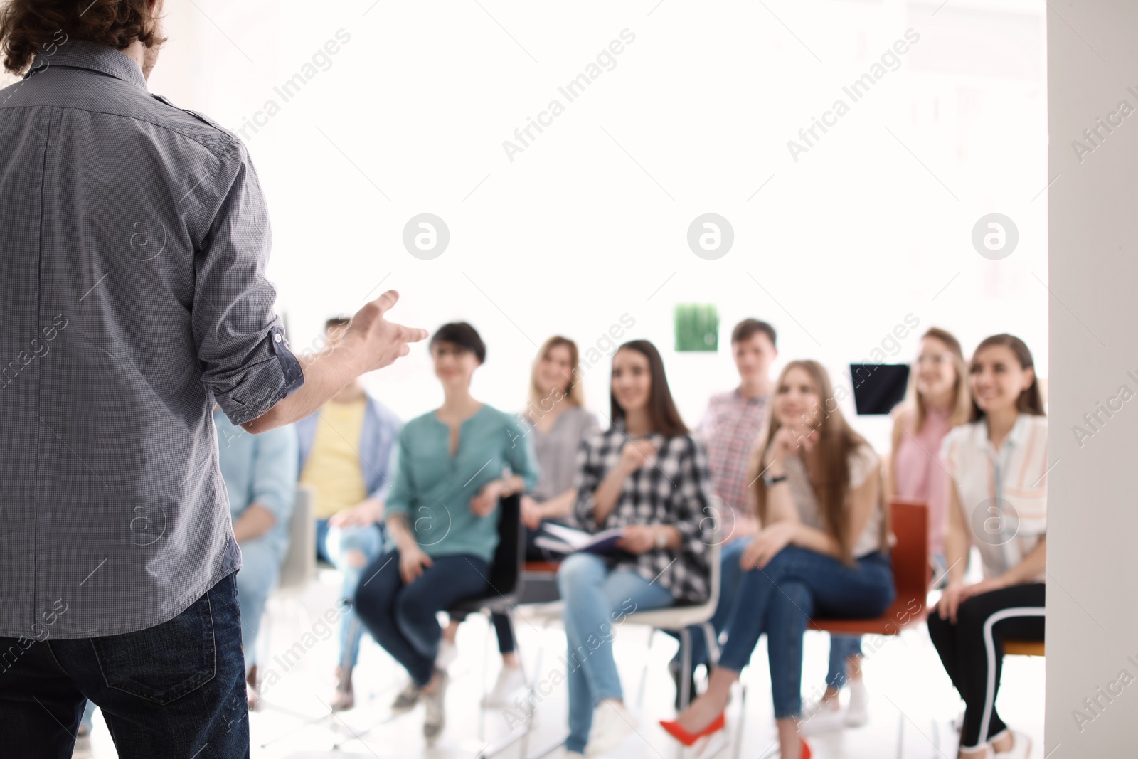 Photo of Male business trainer giving lecture in office