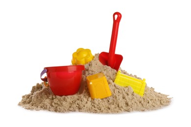 Plastic beach toys on pile of sand against white background. Outdoor play