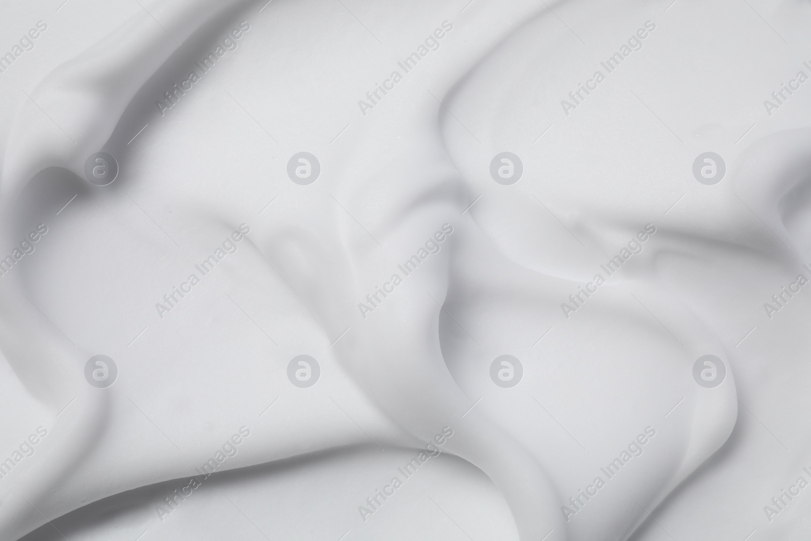 Photo of Texture of white shaving foam as background, top view