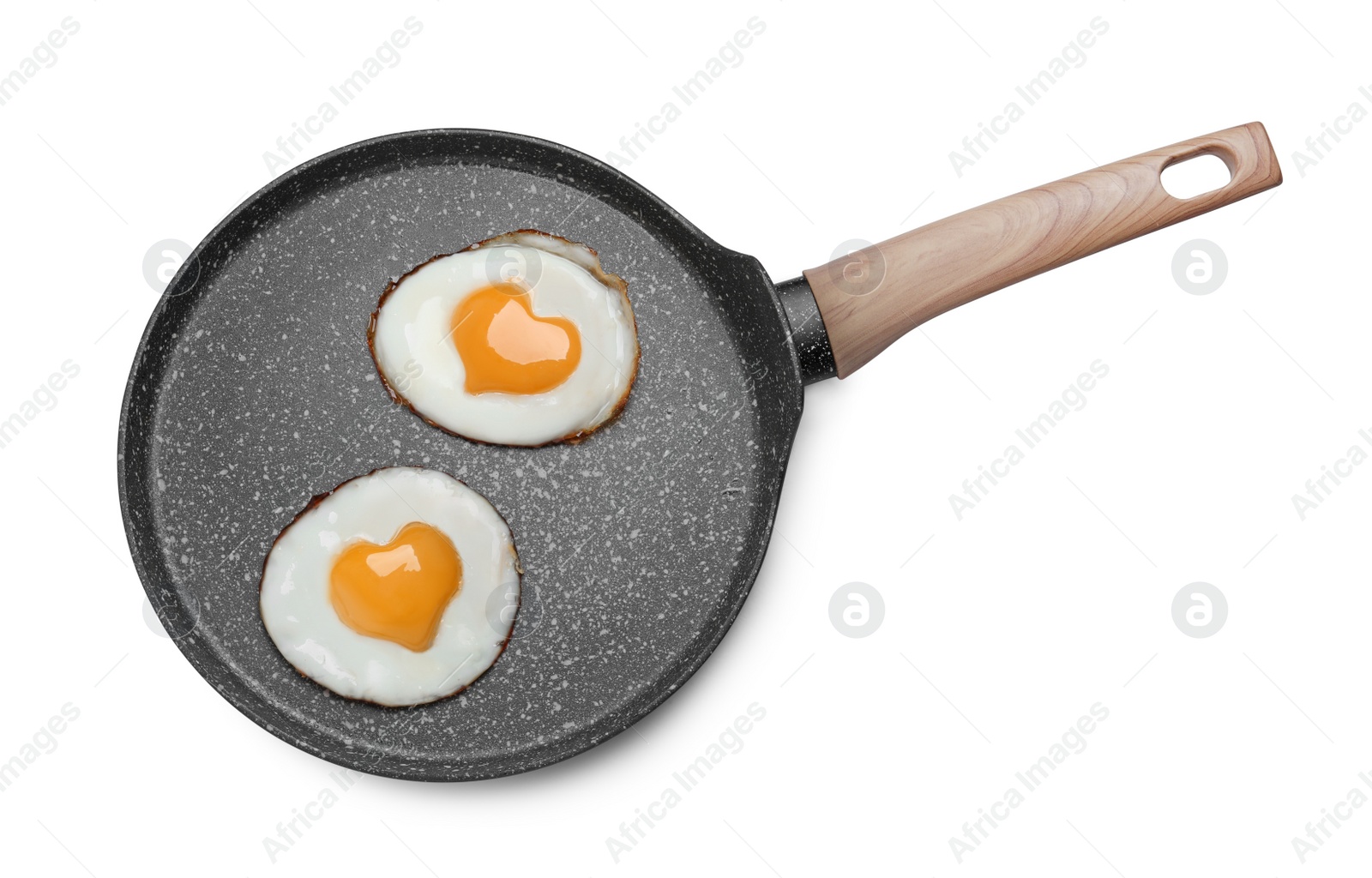 Image of Frying pan with tasty fried eggs with yolks in shape of heart on white background, top view