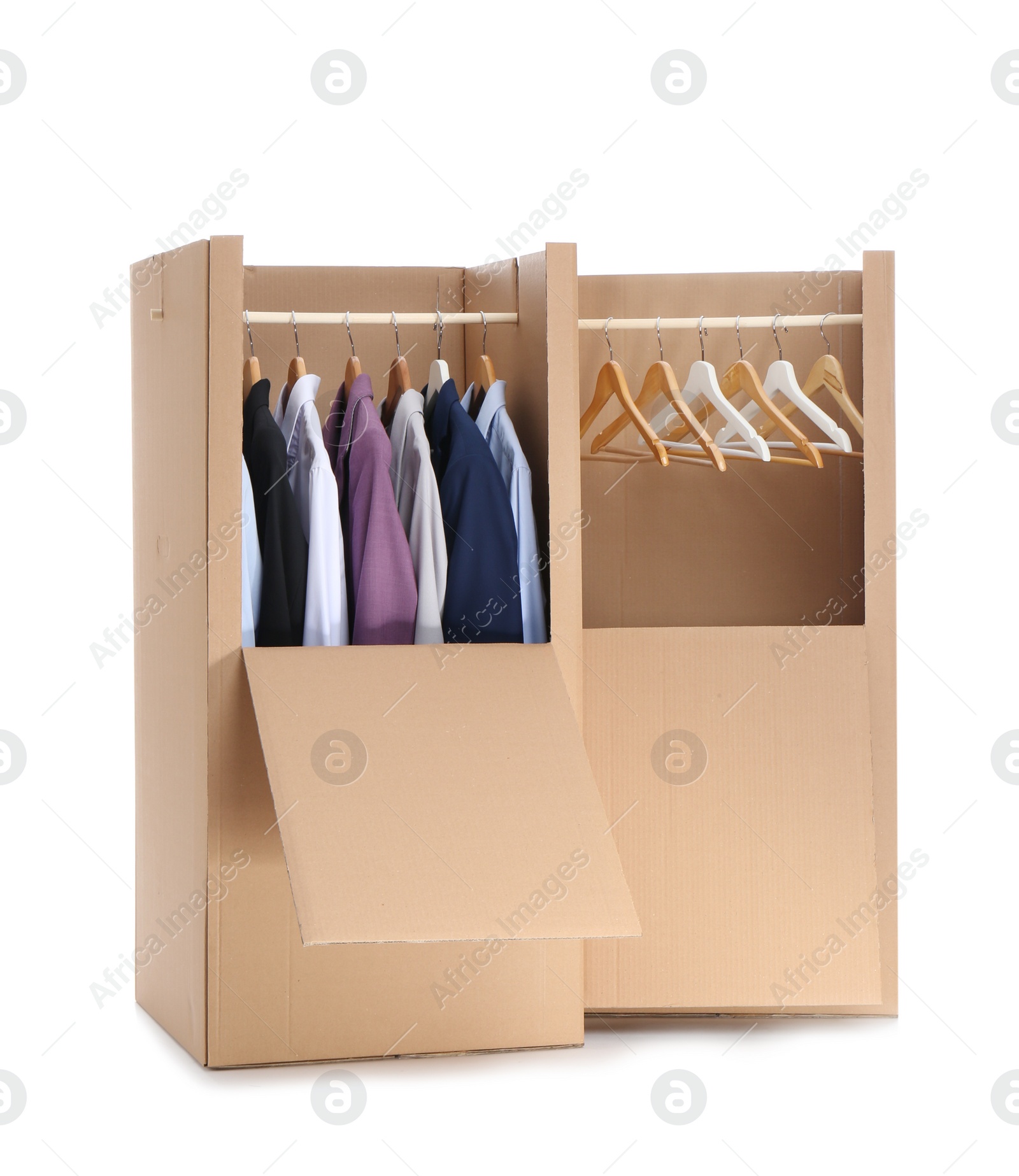 Photo of Wardrobe boxes with clothes on white background