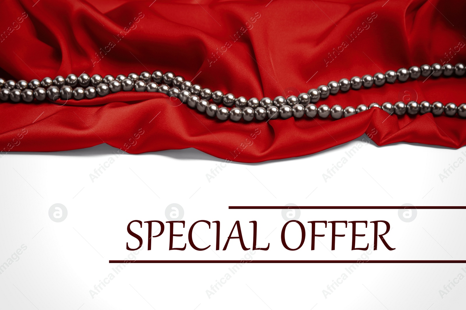 Image of Beautiful pearls, red silk and phrase Special Offer on white background