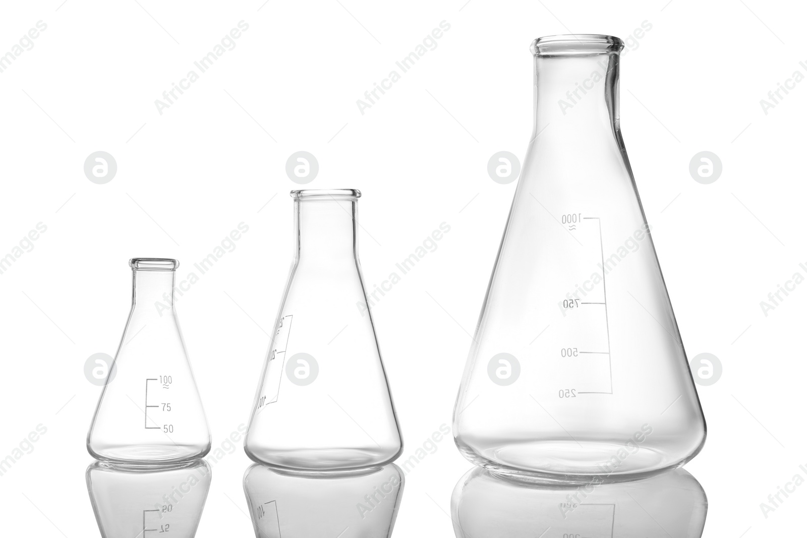 Photo of Empty conical flasks on white background. Laboratory glassware