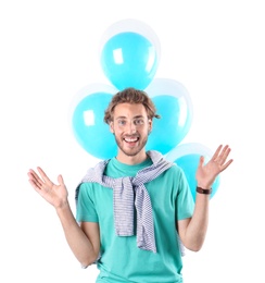 Young man with air balloons on white background