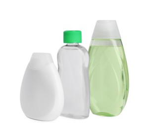Bottles with baby oil, shampoo and gel isolated on white