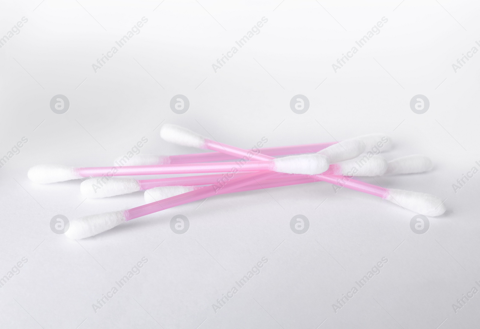 Photo of Clean cotton buds isolated on white. Hygienic product