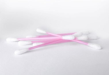 Photo of Clean cotton buds isolated on white. Hygienic product