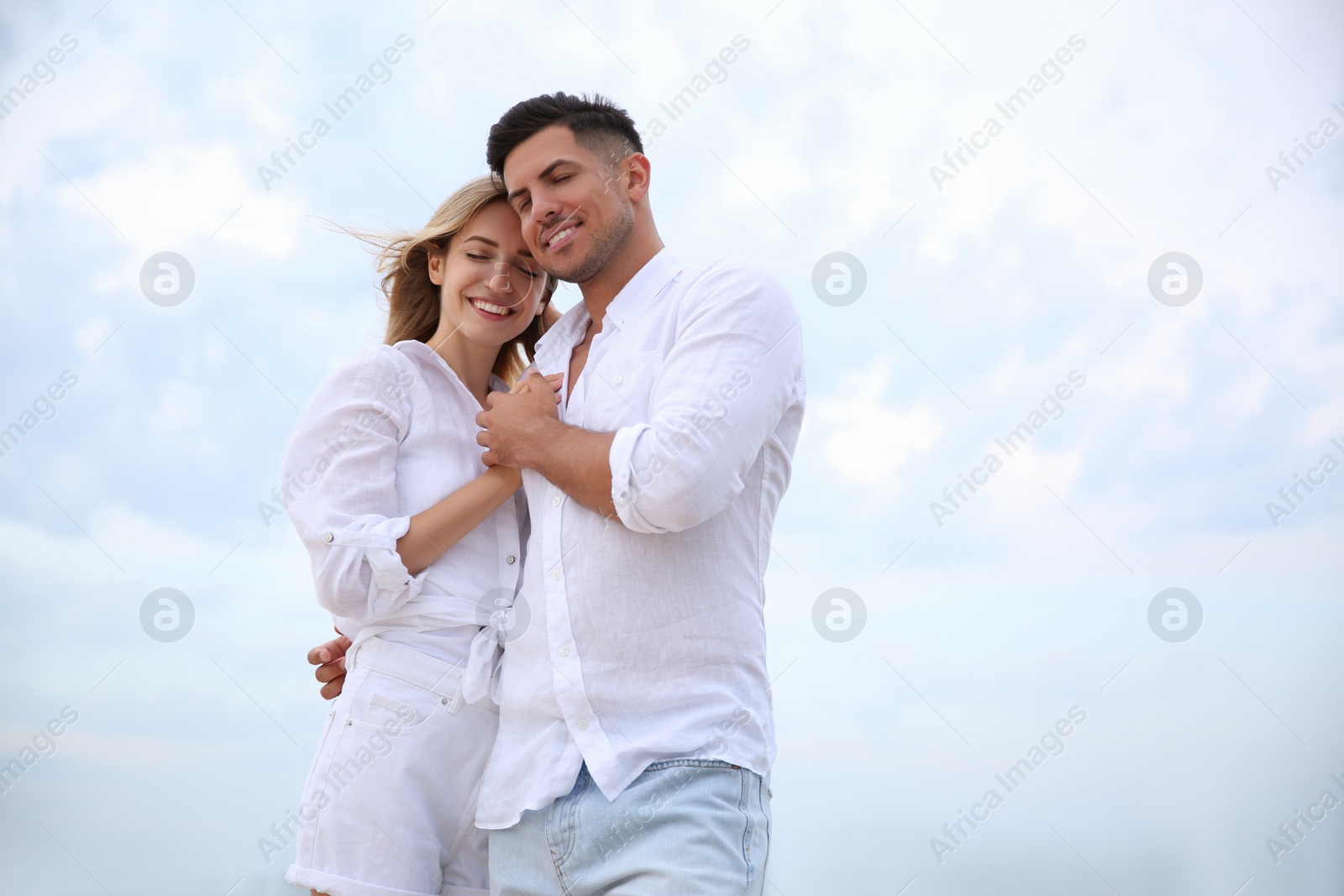 Photo of Happy couple on beach, space for text. Romantic walk