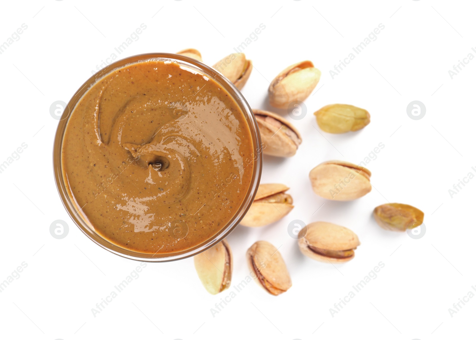 Photo of Delicious nut butter and pistachios isolated on white, top view