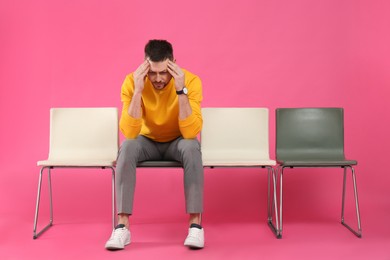 Photo of Man waiting for job interview on pink background