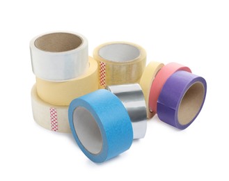 Many different rolls of adhesive tape on white background