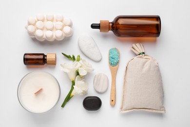Flat lay composition with different spa products on white background