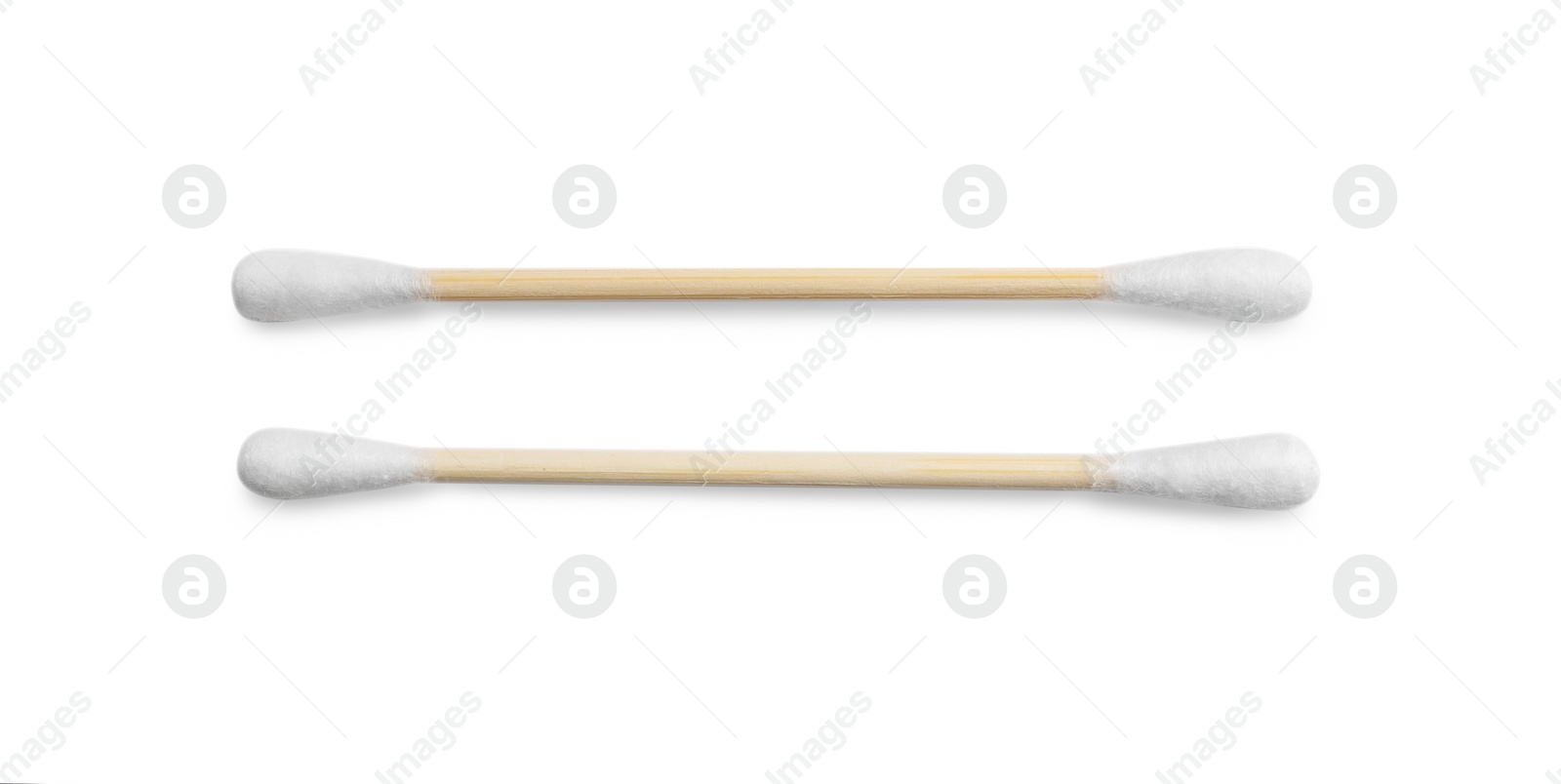 Photo of Wooden cotton buds on white background, top view