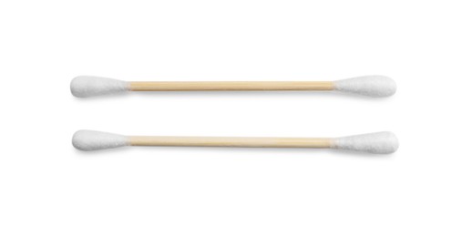 Photo of Wooden cotton buds on white background, top view