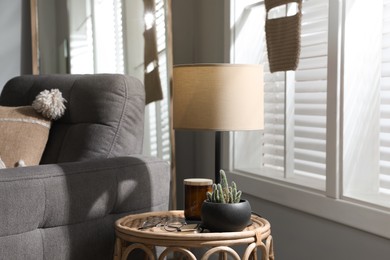 Photo of Room interior with stylish lamp and furniture