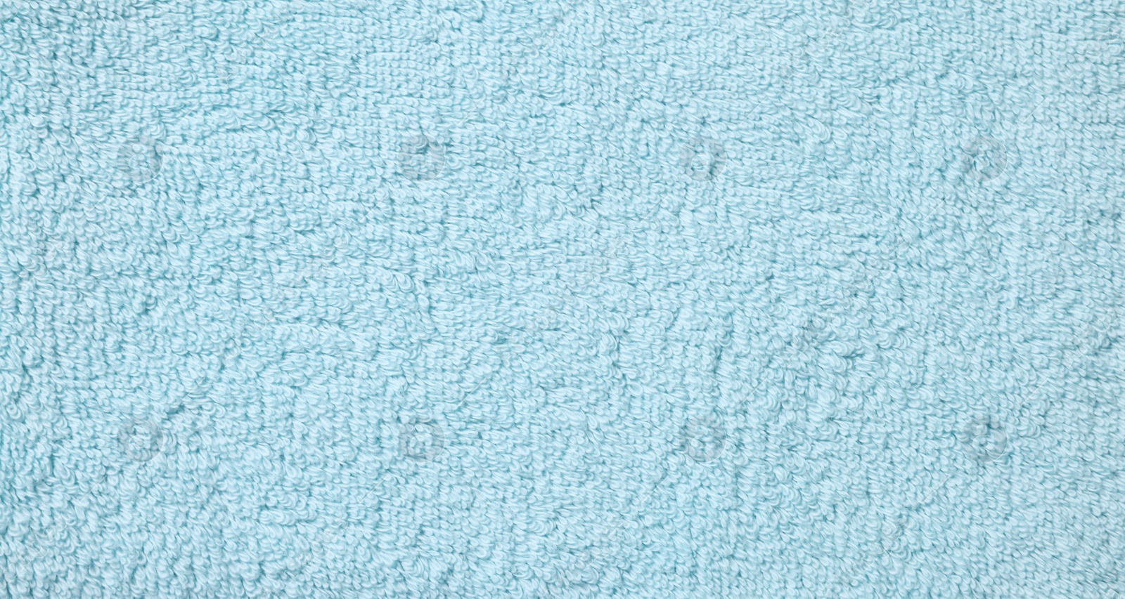 Photo of Texture of soft light blue fabric as background, top view