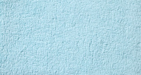 Photo of Texture of soft light blue fabric as background, top view