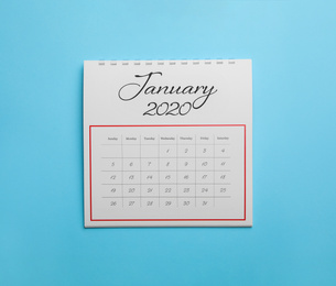Photo of January 2020 calendar on light blue background, top view