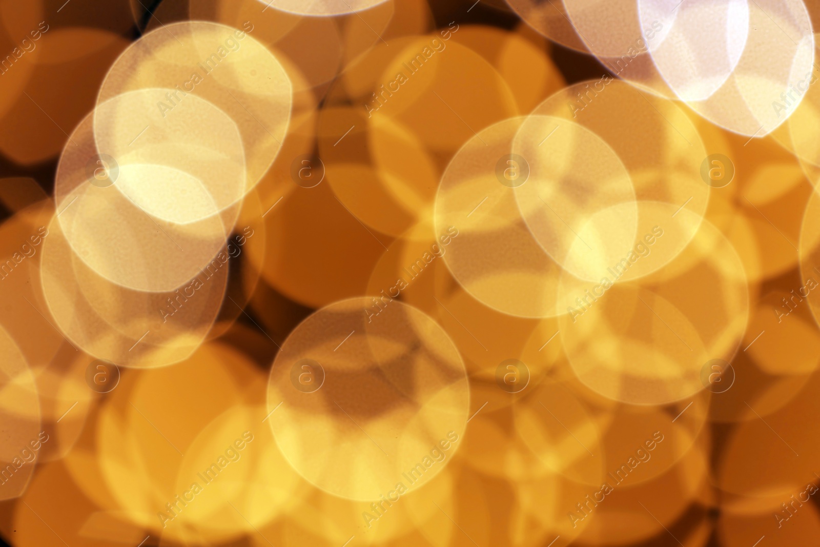 Photo of Beautiful golden lights as background. Bokeh effect