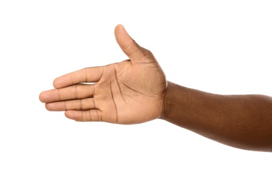 Photo of African-American man extending hand for shake on white background, closeup