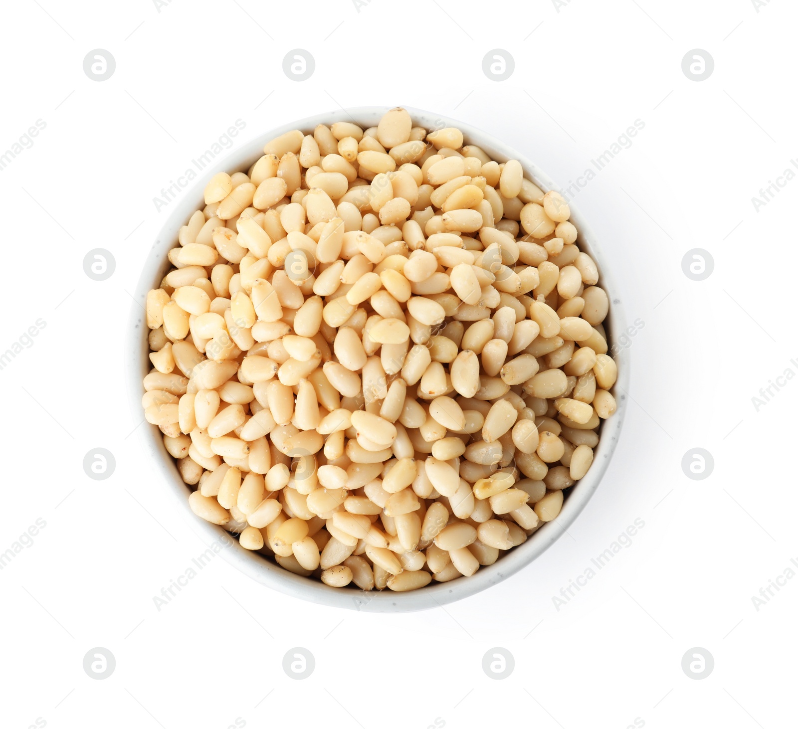 Photo of Bowl with pine nuts on white background, top view