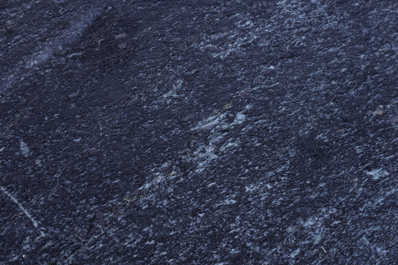 Photo of Macro photo of black marble surface as background, top view