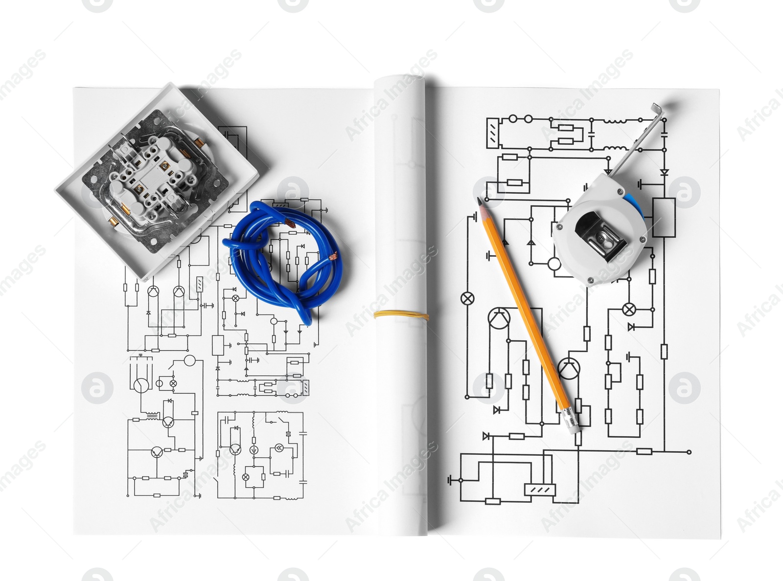 Photo of Wiring diagrams, wires, disassembled light switch, tape measure and pencil isolated on white, top view