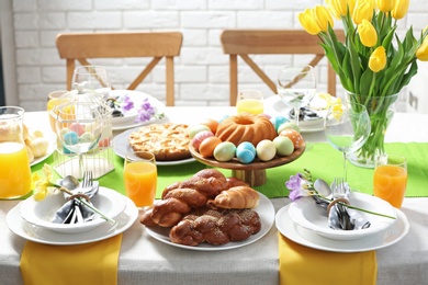 Festive Easter table setting with traditional meal at home